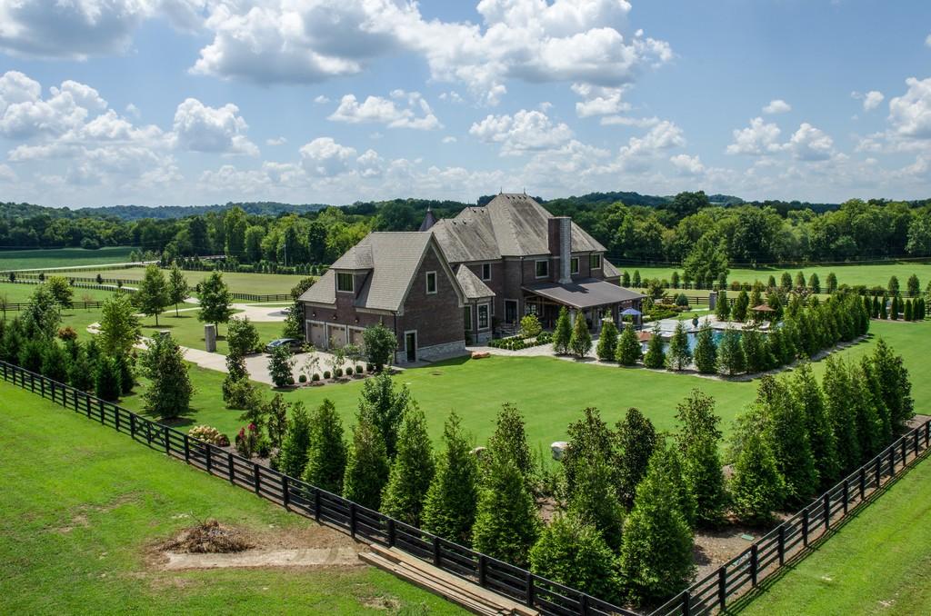 This stunning 20-acre gated estate is in the coveted and bucolic community of Leiper’s Fork in Williamson County. The grand entry features soaring 23-foot ceilings, marble floors and double sweeping staircases. It’s high drama teamed with luxurious beauty. The home has four bedrooms, six full and three half-baths. 3320 Southall Rd, Franklin, TN.