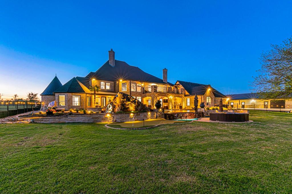 5297 South Farm 549 Home in Rockwall, Texas. Discover this exquisite 12.5-acre estate in Rockwall, boasting over 7100 sqft of luxury living space, 5 beds, 4.3 baths, and unparalleled amenities. Ideal for equestrian enthusiasts and car lovers alike, the property features a 3-stall horse barn, 5-car attached garages.