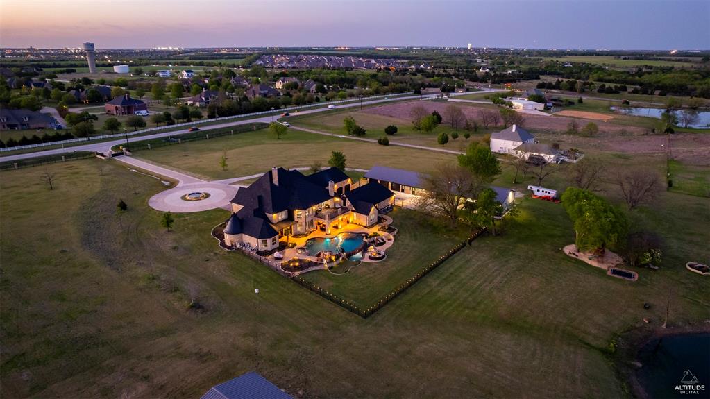 5297 South Farm 549 Home in Rockwall, Texas. Discover this exquisite 12.5-acre estate in Rockwall, boasting over 7100 sqft of luxury living space, 5 beds, 4.3 baths, and unparalleled amenities. Ideal for equestrian enthusiasts and car lovers alike, the property features a 3-stall horse barn, 5-car attached garages.