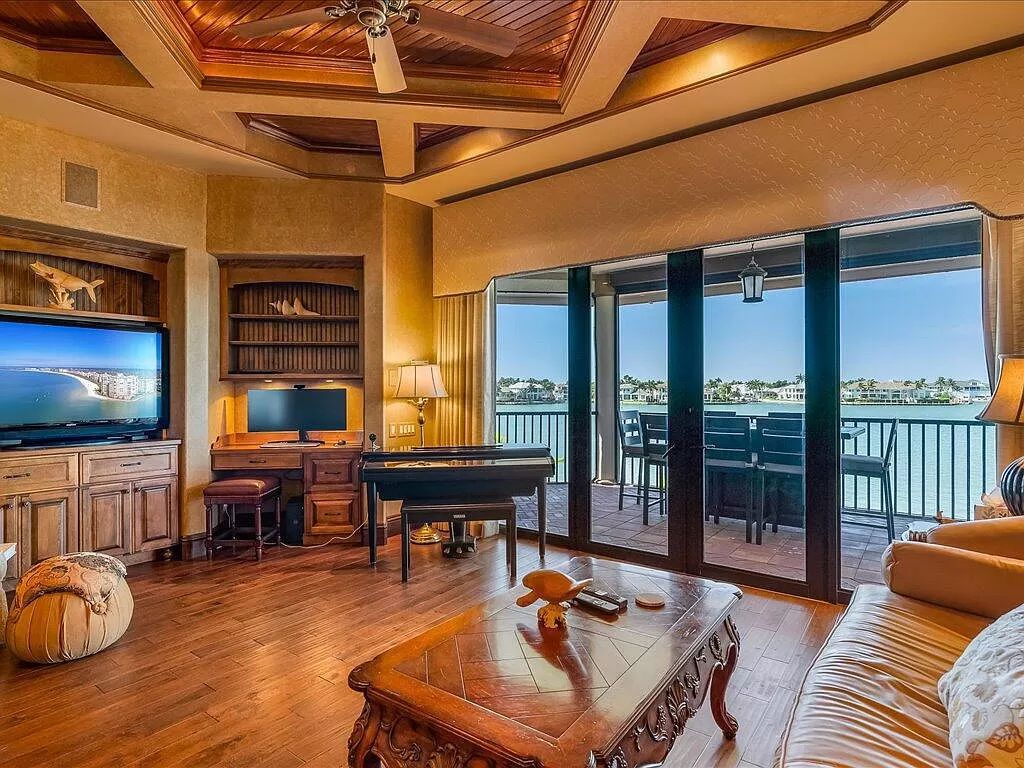 Nestled in the prestigious Tigertail Beach area, this exquisite Tuscan-style home offers unparalleled waterfront living.