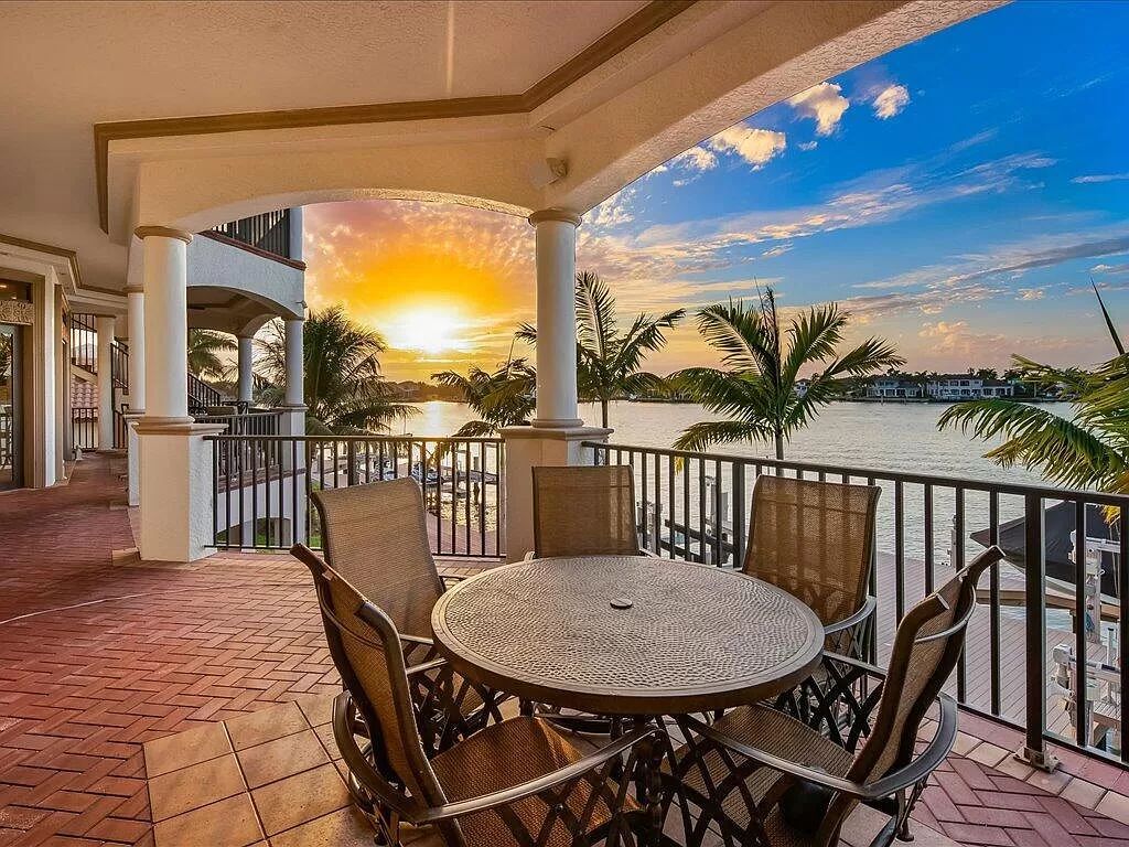 Nestled in the prestigious Tigertail Beach area, this exquisite Tuscan-style home offers unparalleled waterfront living.