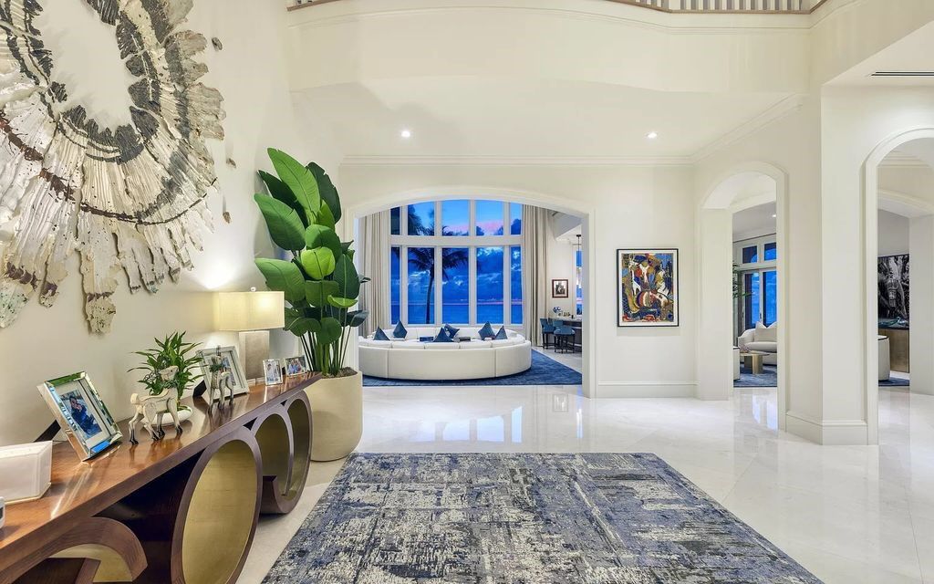 Welcome to 1040 S Ocean Blvd, Manalapan, Florida – an extraordinary ocean-to-Intracoastal compound showcasing 200 feet of ocean frontage and a private dock across Ocean Boulevard. This exquisite estate, built in 2018, spans 16,430 square feet across 2.14 acres, offering 8 bedrooms, 15 bathrooms, and a host of luxurious amenities.