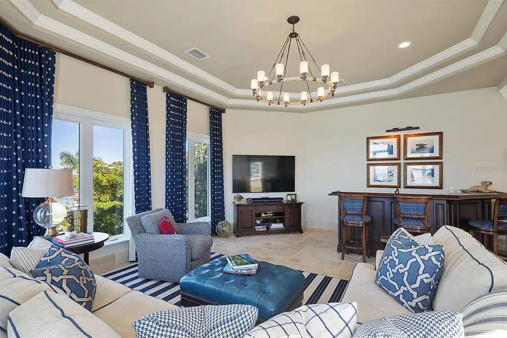 Nestled within the prestigious sanctuary of Harbor Acres in Sarasota, Florida, 1378 Harbor Drive offers a luxurious bayfront lifestyle with breathtaking panoramic views.