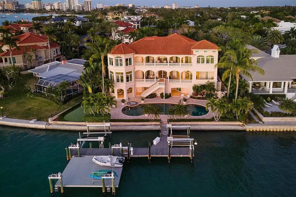 Nestled within the prestigious sanctuary of Harbor Acres in Sarasota, Florida, 1378 Harbor Drive offers a luxurious bayfront lifestyle with breathtaking panoramic views.