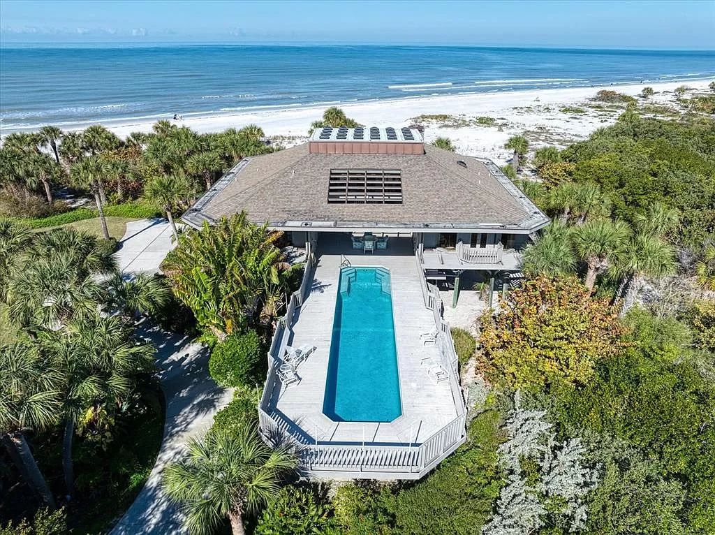 Welcome to 1198 Mandalay Point, a secluded oasis offering unparalleled luxury amidst the natural beauty of Clearwater Beach.