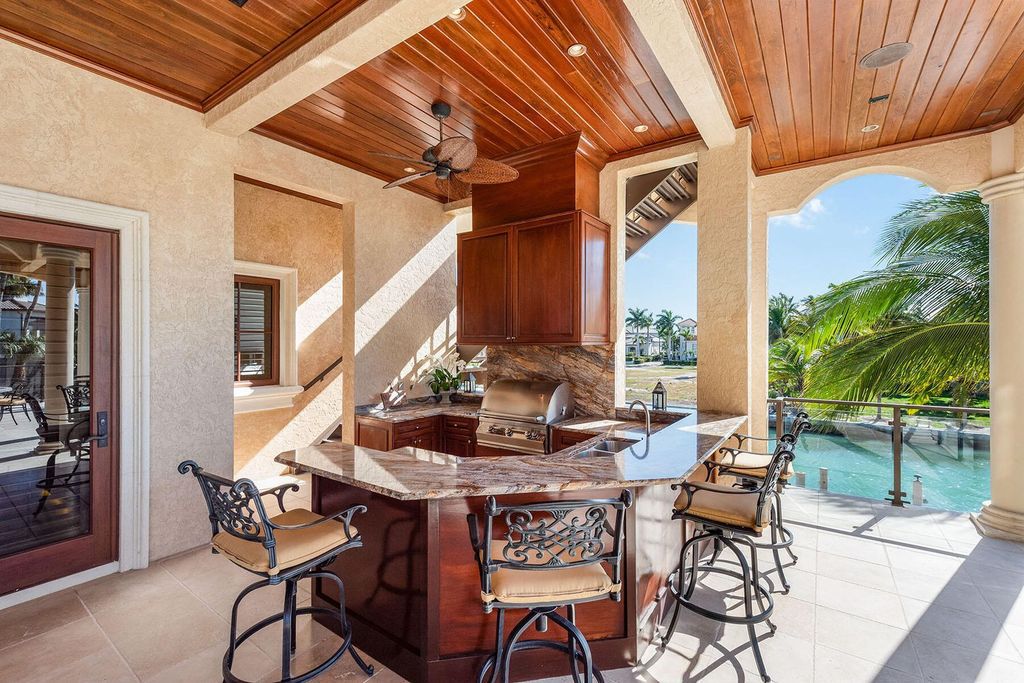 Indulge in the pinnacle of luxury living at this prestigious Marco Island residence in the Estates