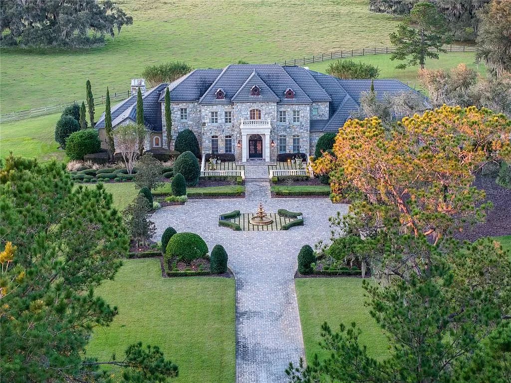 Experience the epitome of luxury living with this magnificent 1935-acre French Country Estate surrounding Lake Ledwith in Micanopy, Florida.