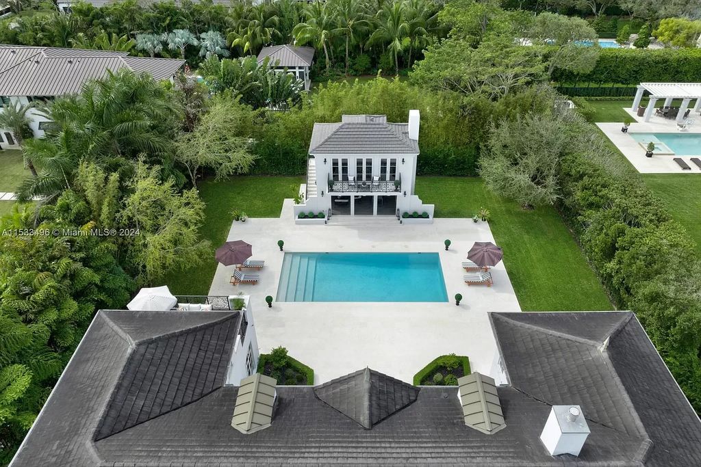 Welcome to an exceptional Ponce-Davis estate boasting meticulous design and luxurious living. From its stunning architectural facade to the custom interiors featuring herringbone hardwood and marble flooring, every detail of this residence exudes elegance.