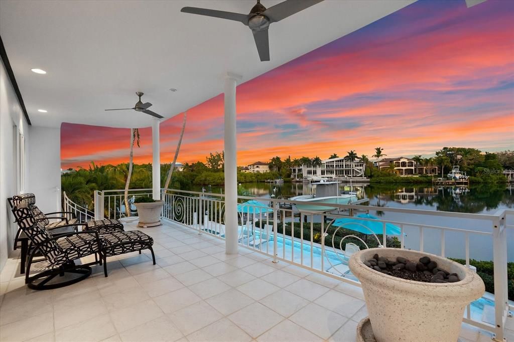 Nestled along the serene shores of Cocoanut Bayou, this captivating 4-bedroom, 4-bathroom sanctuary offers an unparalleled lifestyle for sailboat enthusiasts, boasting two boat lifts and panoramic water views.