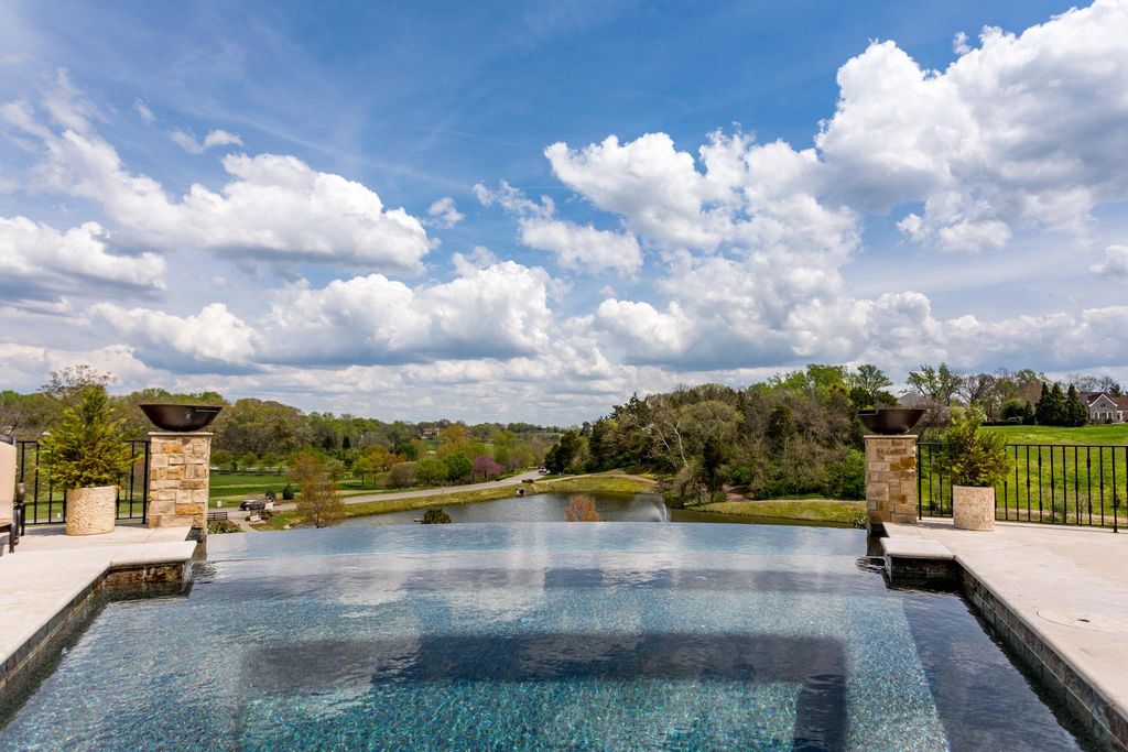 12 Spyglass Hill Home in Brentwood, Tennessee. Discover unparalleled luxury living in the prestigious Governors Club community with this stunning golf course estate. Enjoy updated interior appointments, expansive views of Brentwood hills and Willow Lake, meticulous gardens, and a magnificent infinity pool perfect for entertaining and family enjoyment. 