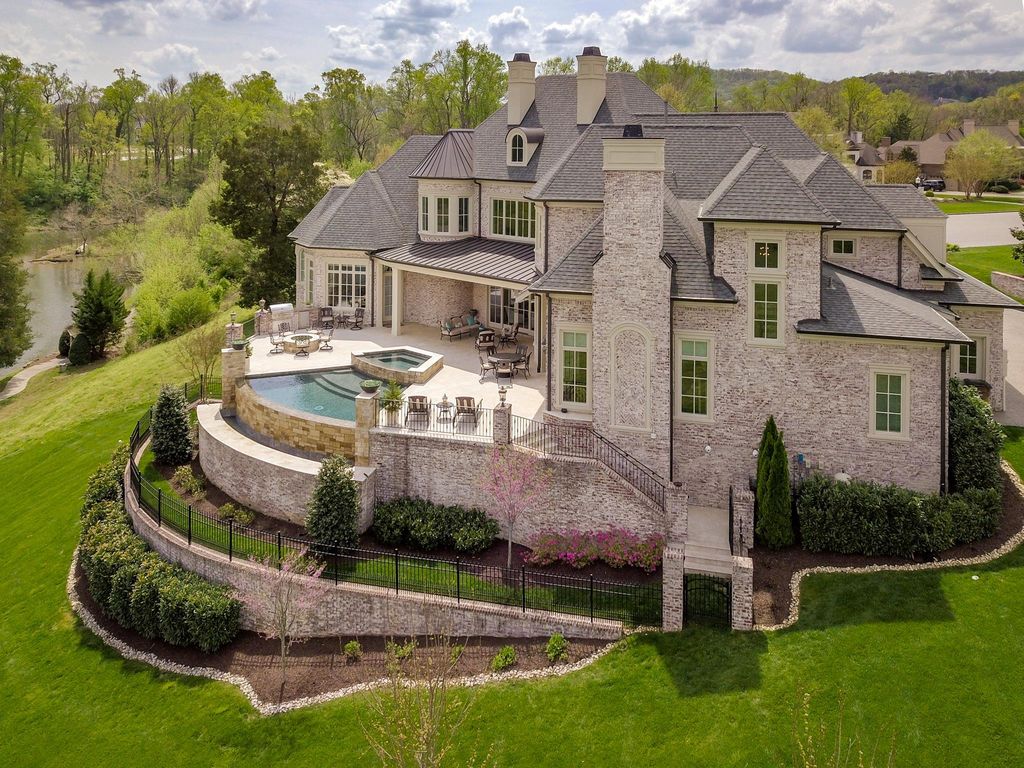 12 Spyglass Hill Home in Brentwood, Tennessee. Discover unparalleled luxury living in the prestigious Governors Club community with this stunning golf course estate. Enjoy updated interior appointments, expansive views of Brentwood hills and Willow Lake, meticulous gardens, and a magnificent infinity pool perfect for entertaining and family enjoyment. 