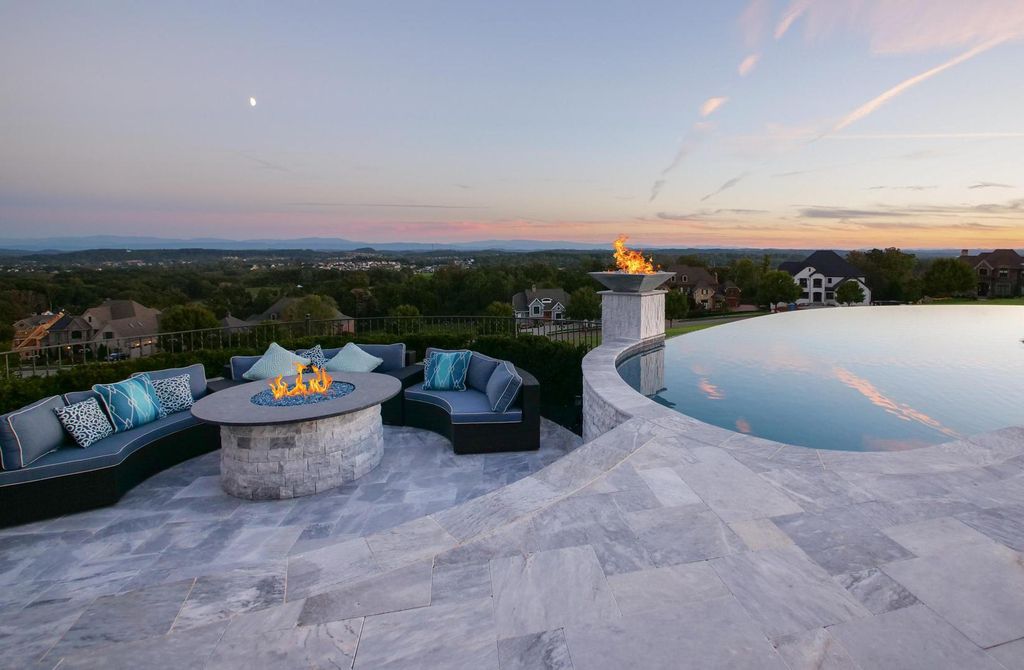 12768 Highwick Circle Home in Knoxville, Tennessee. Explore the epitome of luxury living at this architectural masterpiece nestled in prestigious Bridgemore. Perched atop Farragut's highest point, this one-of-a-kind home offers breathtaking views of the mountains and lake. 