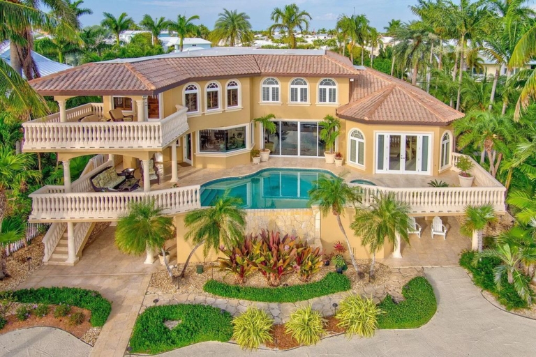 $14.9 Million Oceanfront Estate Offering Unmatched Elegance and Coastal Living Bliss in Key Colony Beach