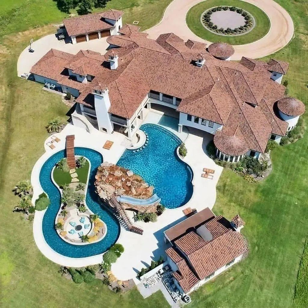1800 Florence Road Home in Keller, Texas. Step into luxury at this sprawling 7-bedroom estate nestled on 10 acres with a serene pond. From the grand entrance with custom chandeliers to the resort-inspired backyard featuring a lazy river, grotto, and swim-up bar, every detail exudes opulence.