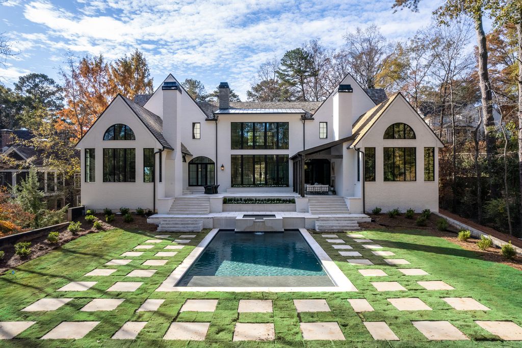 2845 Normandy Drive NW Home in Atlanta, Georgia. Discover luxury living in the heart of Buckhead with this stunning home crafted by Harrison Design and White Oak Fine Homes. this transitional-style masterpiece features bespoke touches, soaring ceilings, and expansive windows offering views of the pool and manicured grounds.