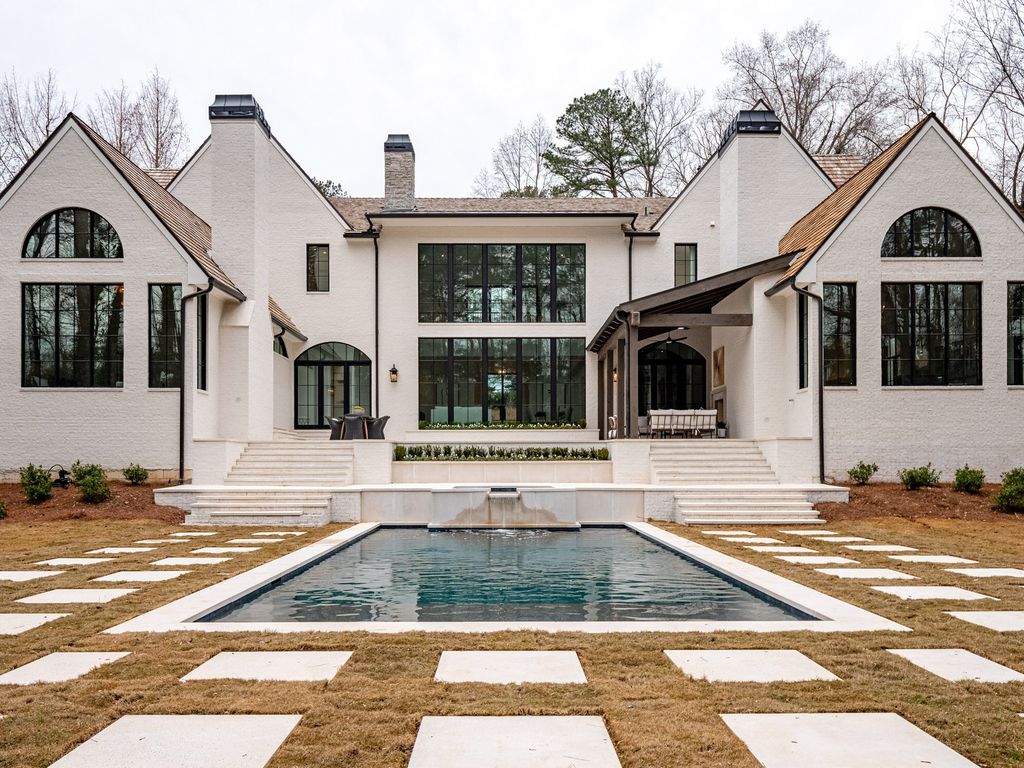 2845 Normandy Drive NW Home in Atlanta, Georgia. Discover luxury living in the heart of Buckhead with this stunning home crafted by Harrison Design and White Oak Fine Homes. this transitional-style masterpiece features bespoke touches, soaring ceilings, and expansive windows offering views of the pool and manicured grounds.