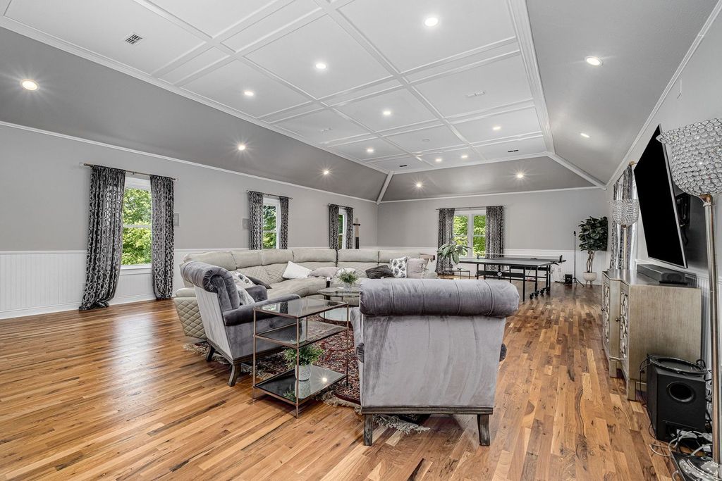 305 Granny White Pike Home in Brentwood, Tennessee. Discover this exquisite renovated home in Williamson County, boasting 2.03 lush acres with private gate entry and driveway fountain.