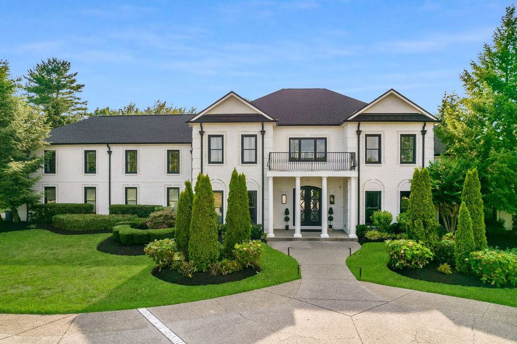 305 Granny White Pike Home in Brentwood, Tennessee. Discover this exquisite renovated home in Williamson County, boasting 2.03 lush acres with private gate entry and driveway fountain.