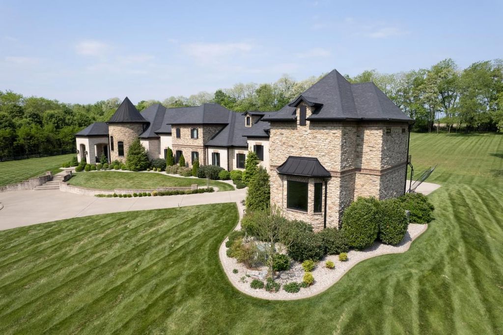 520 Cassity Way Home in Nicholasville, Kentucky. Step into luxury living with this masterpiece estate, boasting artistic appointments, exceptional construction quality, and unique features like a 24' tall turret entertainment room, handcrafted doors, and specialty granites. 