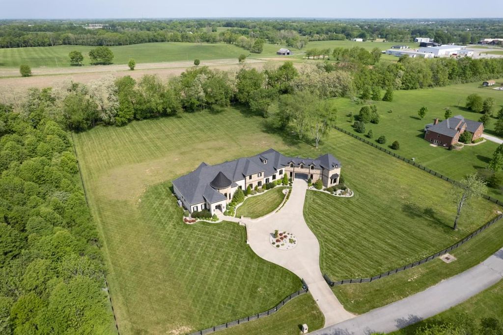 520 Cassity Way Home in Nicholasville, Kentucky. Step into luxury living with this masterpiece estate, boasting artistic appointments, exceptional construction quality, and unique features like a 24' tall turret entertainment room, handcrafted doors, and specialty granites. 
