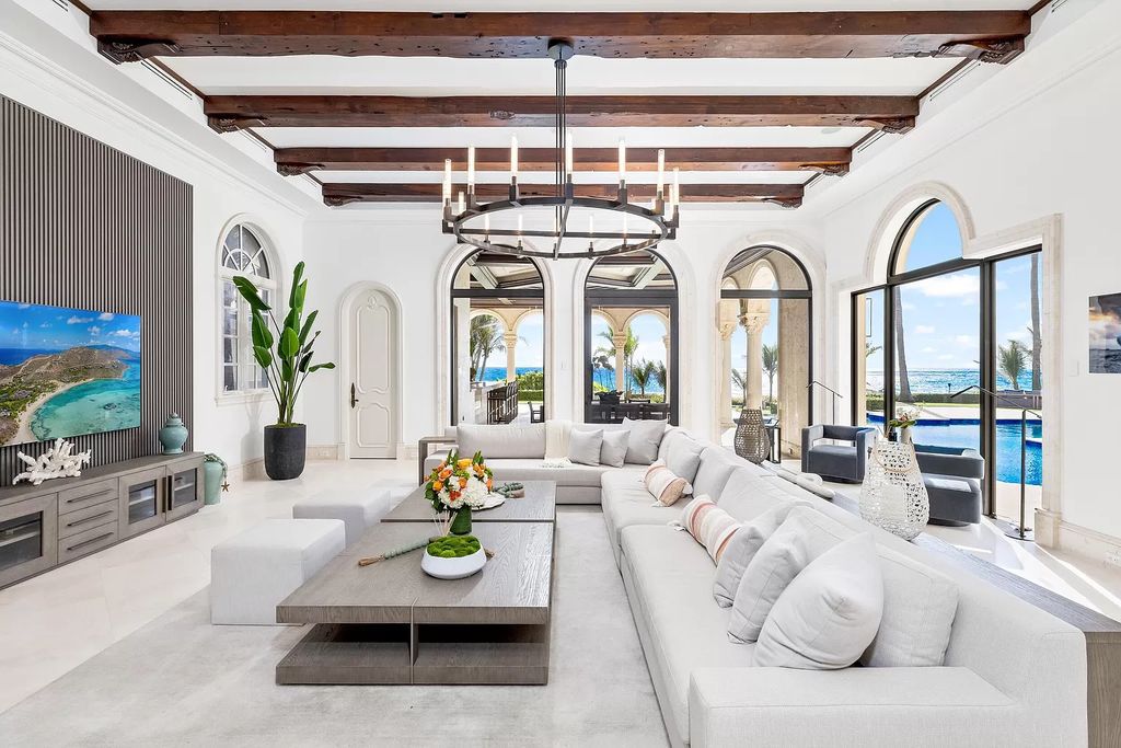 Welcome to "Mar Pietra," a stunning oceanfront estate in Delray Beach, Florida, epitomizing contemporary Italian Renaissance luxury. Behind private gates, discover a sprawling compound on over an acre, featuring lush landscaping, a resort-style pool, and panoramic ocean views.
