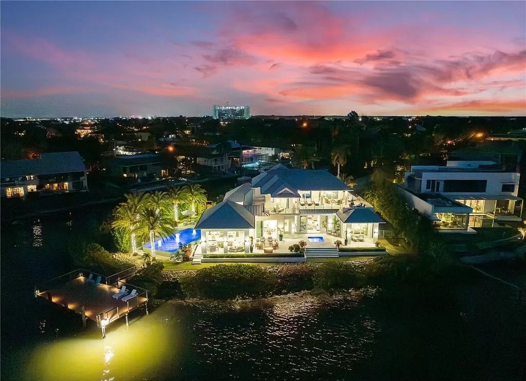 Experience unparalleled waterfront luxury living at 1340 Jewel Box Ave, Naples, Florida. This exceptional residence offers over 5,600 square feet of meticulously designed living space, showcasing breathtaking Gulf of Mexico sunsets from nearly every room.