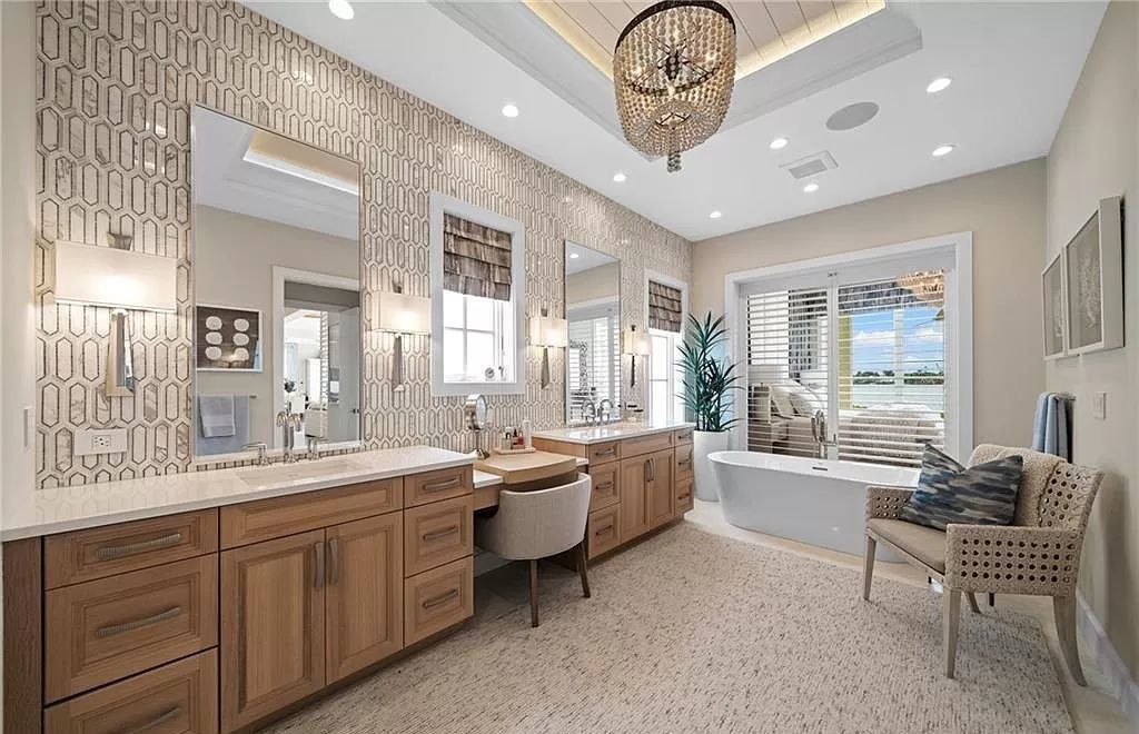 Experience unparalleled waterfront luxury living at 1340 Jewel Box Ave, Naples, Florida. This exceptional residence offers over 5,600 square feet of meticulously designed living space, showcasing breathtaking Gulf of Mexico sunsets from nearly every room.