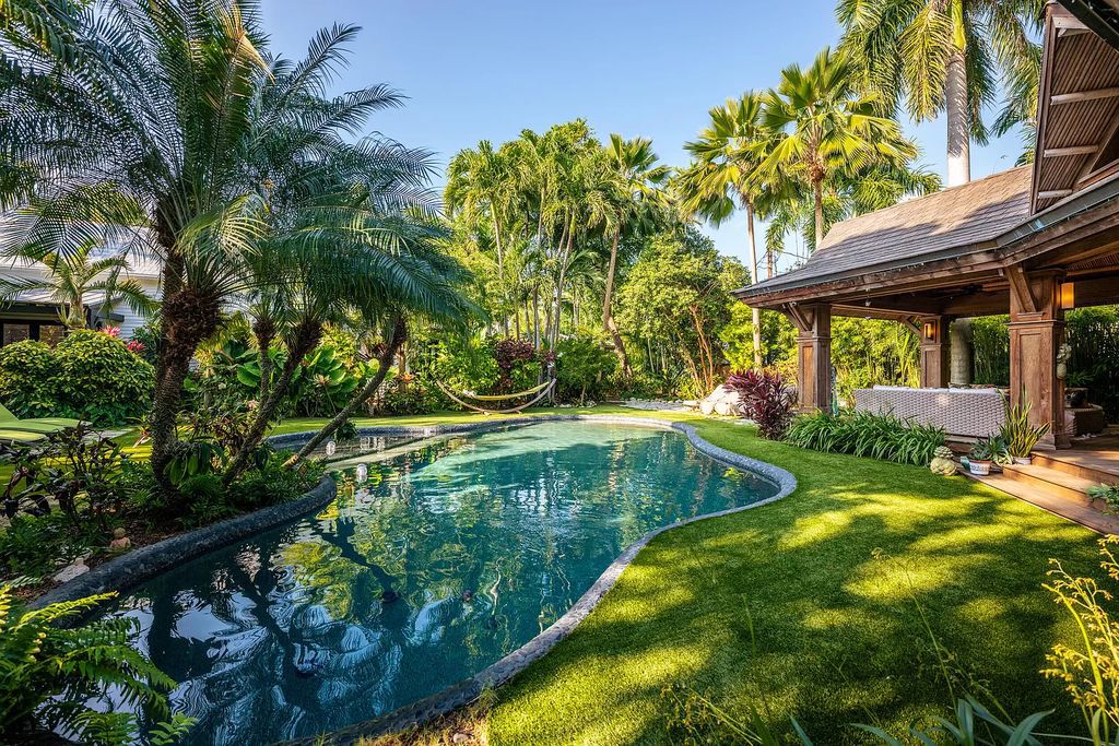 Nestled behind modest gates, 908 Fleming Street in Key West, Florida, unveils a world of unparalleled luxury and tranquility.