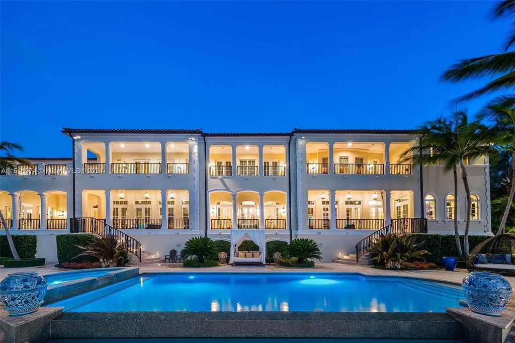 Nestled within the prestigious guard-gated community of Gables Estates, 33 Arvida Parkway presents a magnificent 14,972-square-foot estate boasting 225 feet of waterfront on a lushly landscaped 35,389-square-foot lot.