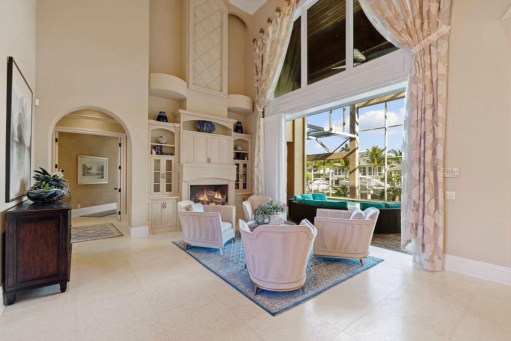 Experience unparalleled luxury living at this waterfront estate in Tigertail/Collier Bay, Marco Island. Boasting over $400,000 in price reduction, this multi-level home features a private elevator, 6 bedrooms, 7 bathrooms, 2 living rooms, a den, and a formal dining room, spanning just over 6,500 square feet of living space.