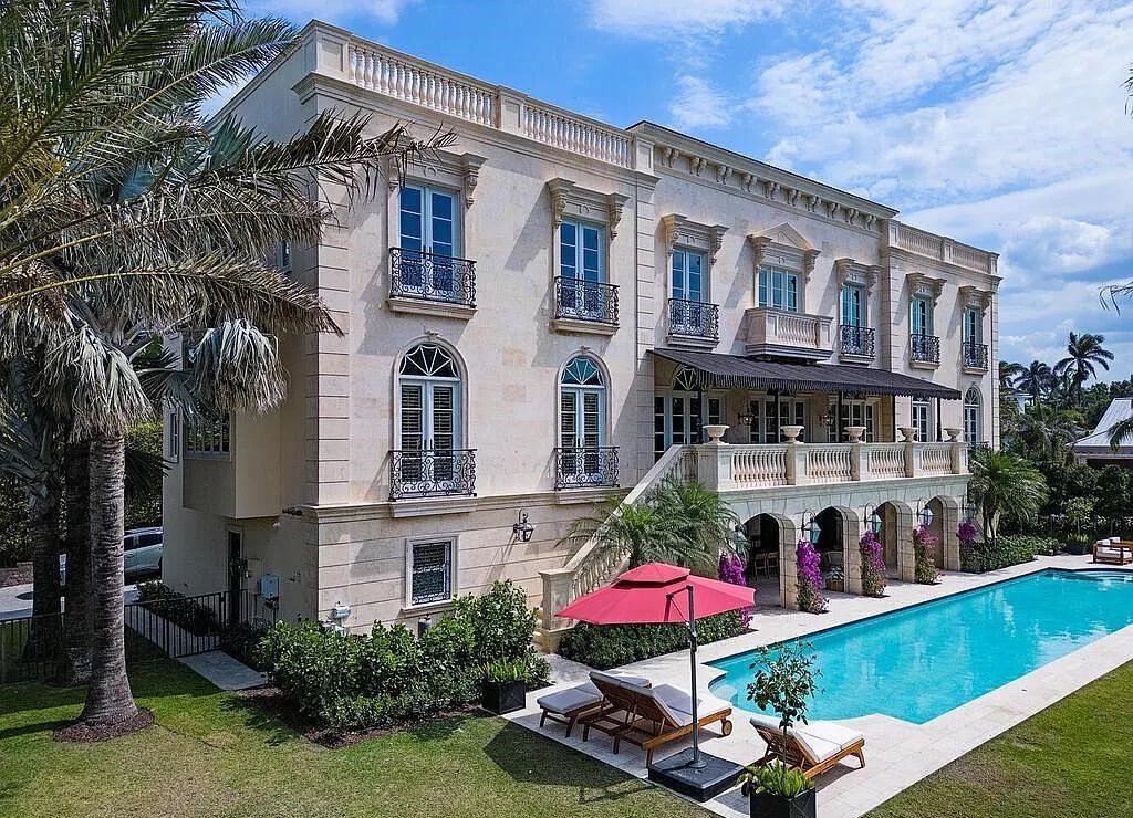 Indulge in the epitome of luxury living with this stunning French Colonial-inspired estate in Naples, Florida. Adorned with imported Italian marble, the exterior of this architectural masterpiece sets the stage for opulence.