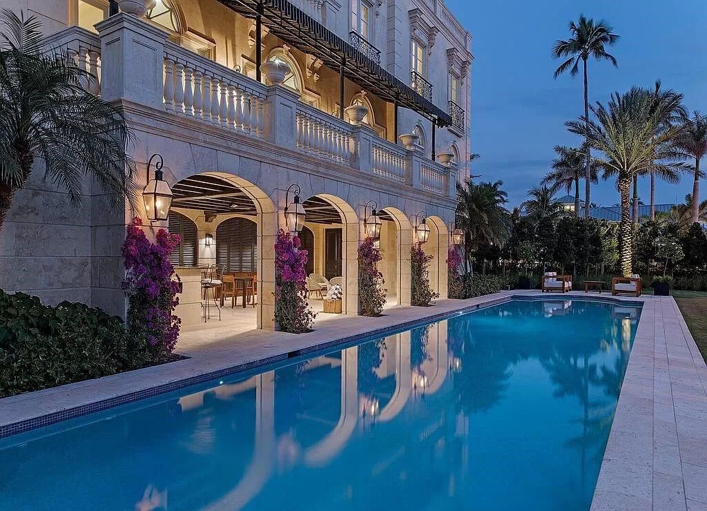 Indulge in the epitome of luxury living with this stunning French Colonial-inspired estate in Naples, Florida. Adorned with imported Italian marble, the exterior of this architectural masterpiece sets the stage for opulence.