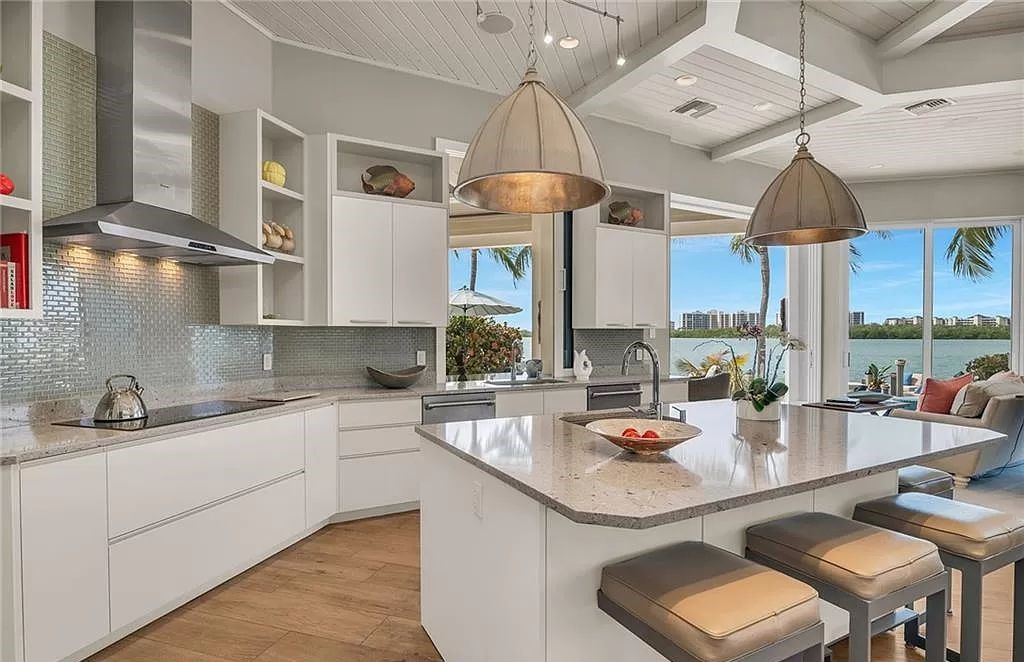 Discover unparalleled luxury waterfront living at 810 Perrine Ct, located in Marco Island's prestigious Old Marco neighborhood.