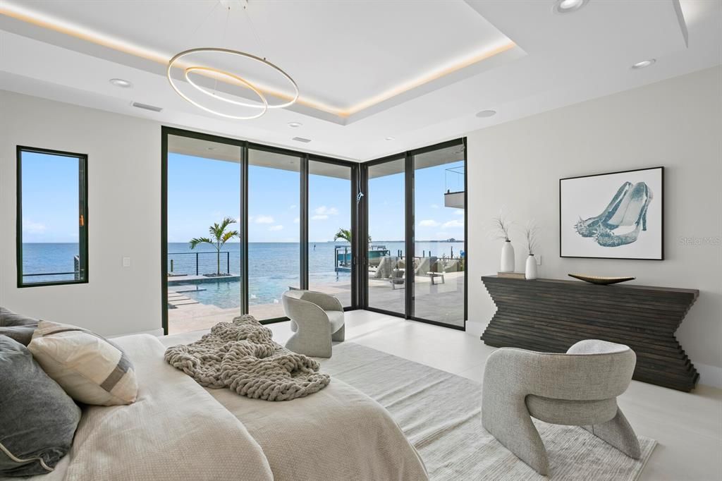 Welcome to 1721 Brightwaters Blvd NE, a stunning modern masterpiece in St. Petersburg's exclusive Snell Isle neighborhood. This completed new construction offers 6 bedrooms, 7 full baths, and 2 half baths across 7,087 square feet of luxurious living space, with 100 feet of waterfrontage overlooking Tampa Bay.