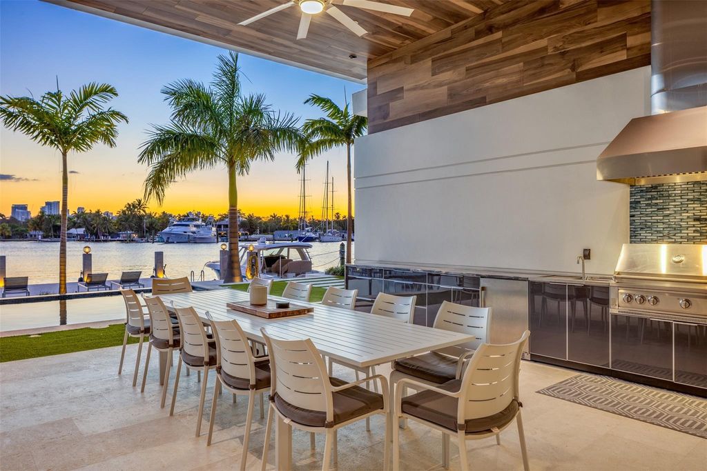 Rebuilt in July 2023, this single-story smart home offers 5,073 square feet of sophisticated living space on a sprawling 15,300-square-foot lot with a 2,300-square-foot dock adorned with coral stone from Spain.