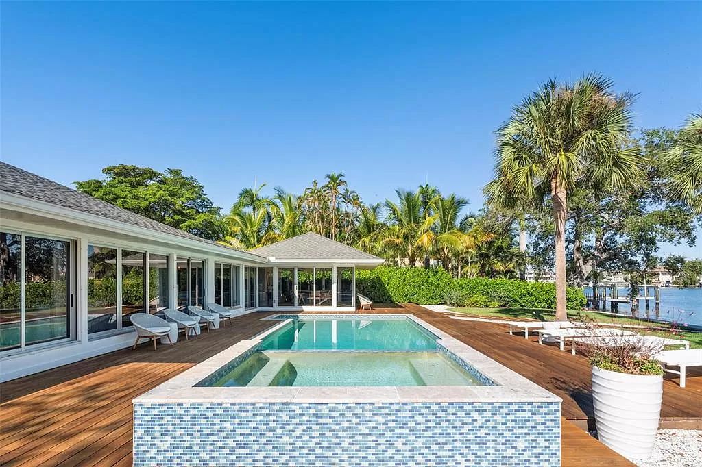 Welcome to 1449 Hillview Dr, Sarasota, Florida, a waterfront oasis in the coveted Harbor Acres Estate Section.