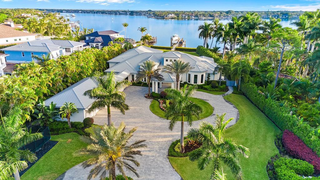 Nestled on the scenic Loxahatchee River, this 5-bedroom, 6-bathroom estate in Jupiter, Florida offers the epitome of luxury living.
