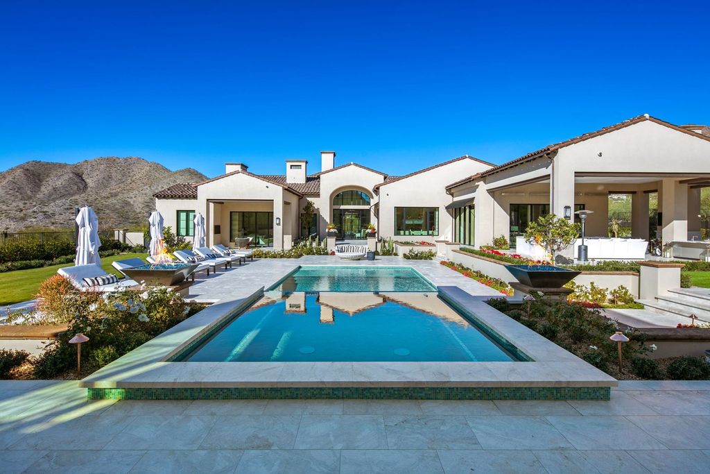 Immerse yourself in the epitome of luxury living with this exceptional estate nestled in Silverleaf's Upper Canyon. Boasting stunning mountain and city vistas, this rare near-level 2.15-acre lot offers expansive grounds with meticulously manicured gardens, perfect for outdoor entertaining. 10927 E Windgate Pass Drive 1519 Home in Scottsdale, Arizona.