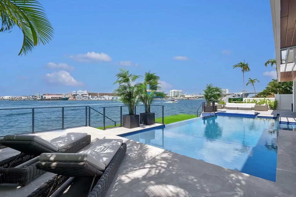 Experience unparalleled luxury living in this newly constructed modern waterfront estate located in Fort Lauderdale. With a Certificate of Occupancy issued and available turnkey, this stunning property boasts enchanting views of the intracoastal, ocean inlet, and passing cruise ships and yachts.