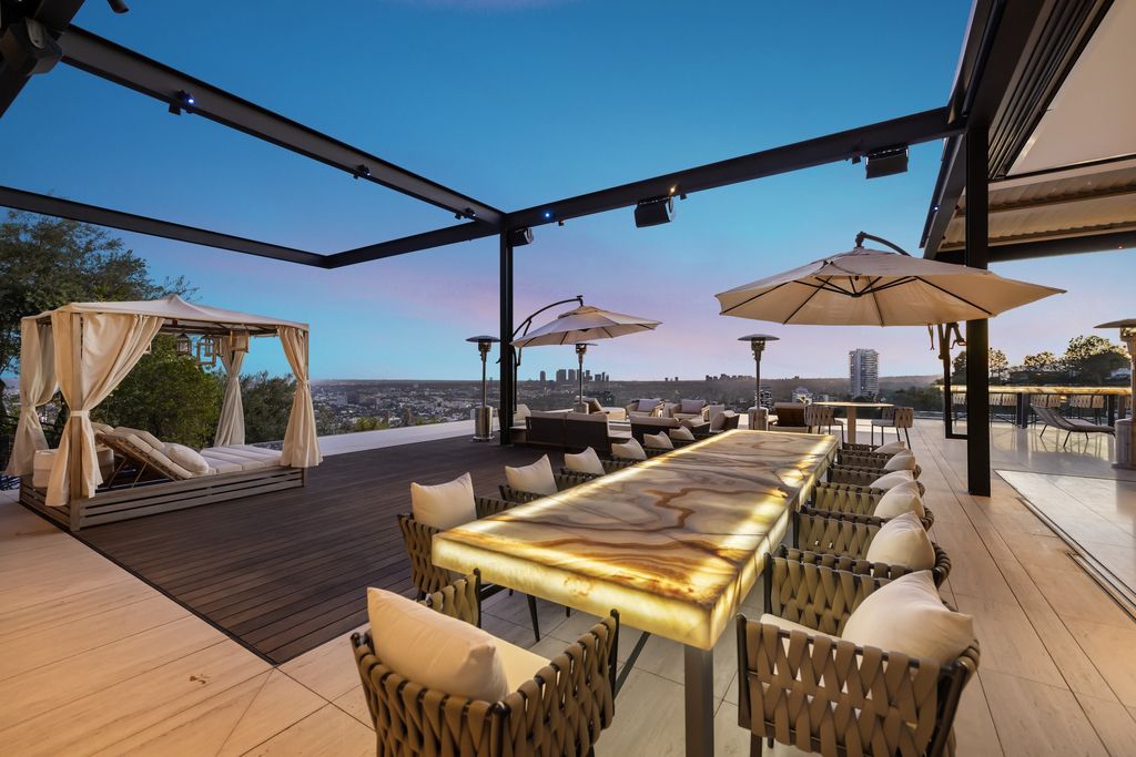 1305 Collingwood Place Home in Los Angeles, California. Experience luxury living at its finest in this sophisticated 6-bedroom, 8-bathroom compound nestled in the Hollywood Hills. With expansive living spaces, stunning panoramic views from Downtown LA to the Pacific Ocean. 