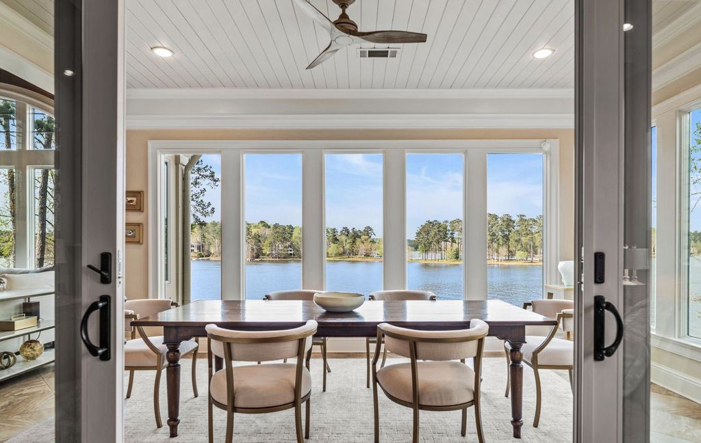1461 North Shore Drive Home in Greensboro, Georgia. Discover unmatched luxury at this stunning family lake house near the Ritz and LakeClub. Enjoy expansive lake views, resort-style infinity pool, 4-car garage, spacious suites, two kitchens, and an elevator. 