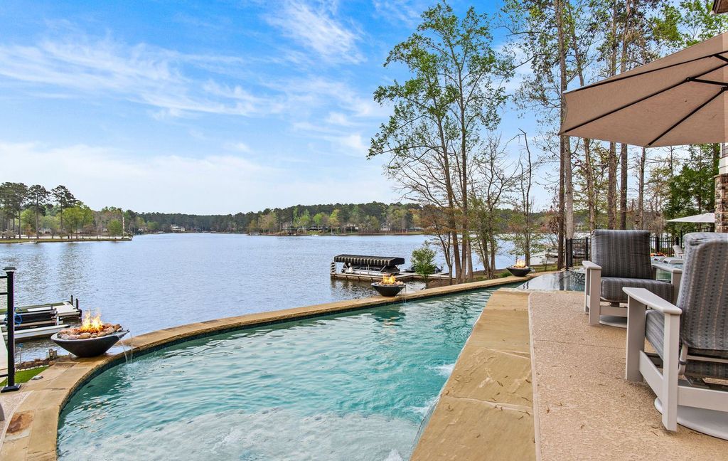 1461 North Shore Drive Home in Greensboro, Georgia. Discover unmatched luxury at this stunning family lake house near the Ritz and LakeClub. Enjoy expansive lake views, resort-style infinity pool, 4-car garage, spacious suites, two kitchens, and an elevator. 