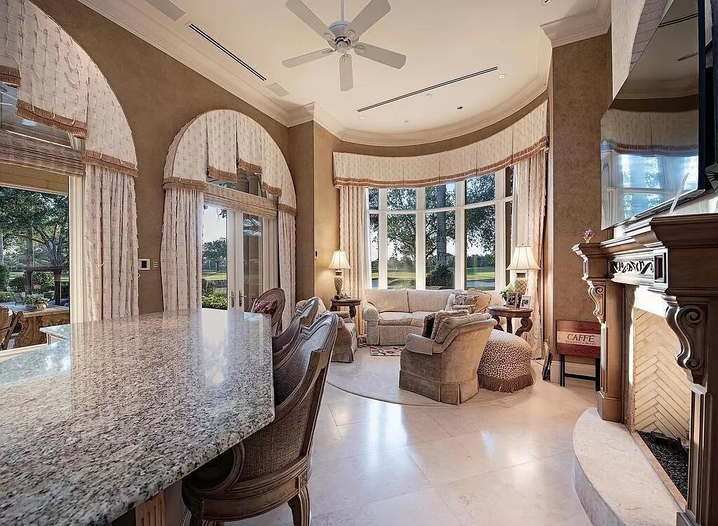 Discover unparalleled luxury living in the prestigious Estates at Bay Colony with this exquisite European-inspired residence nestled on a double lakefront estate.
