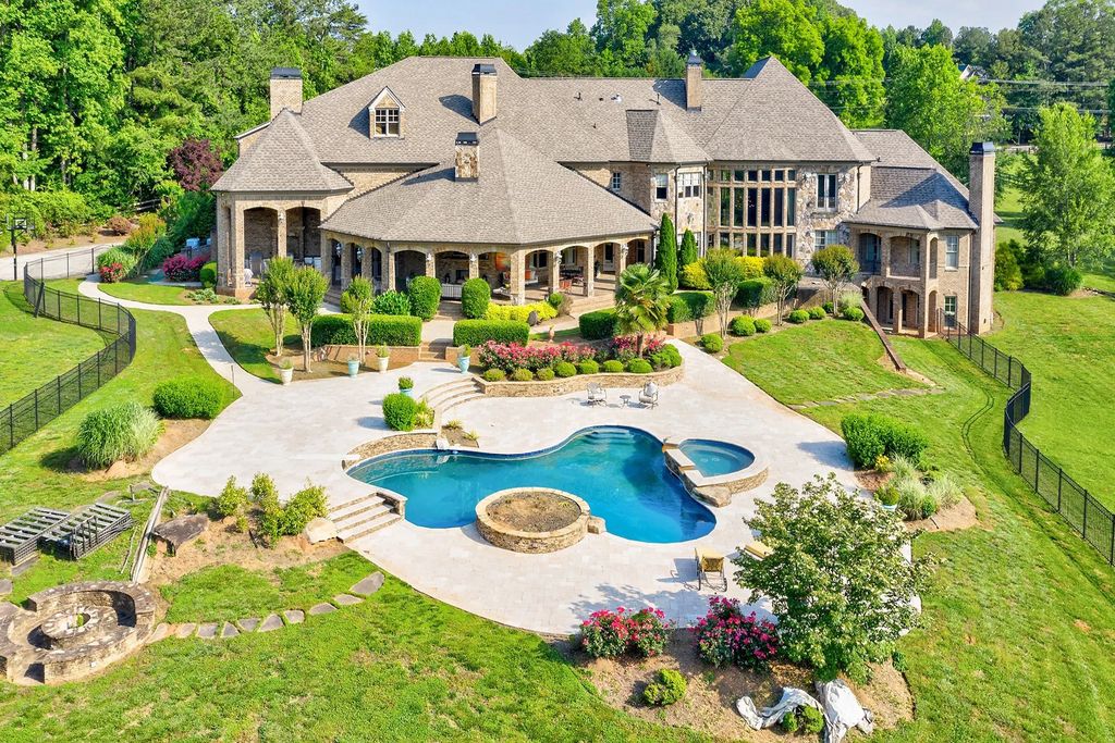 4186 N Arnold Mill Road Home in Woodstock, Georgia. Discover Stone Creek Manor, an exquisite estate offering hand-crafted elegance and olde world design in Cherokee County. Enjoy lower taxes, proximity to Roswell & Alpharetta, and easy access to local private schools and shopping.