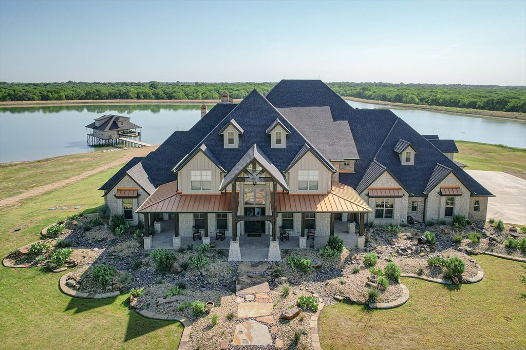 430 Chaparall Road Home in Ferris, Texas. Discover this breathtaking custom lake home nestled on 514 secluded acres, just 15 minutes south of Dallas. Meticulously constructed with stunning lake views from every room, this home features vaulted ceilings, a chef's dream kitchen, luxurious owner's suite, formal dining, study, and more. 