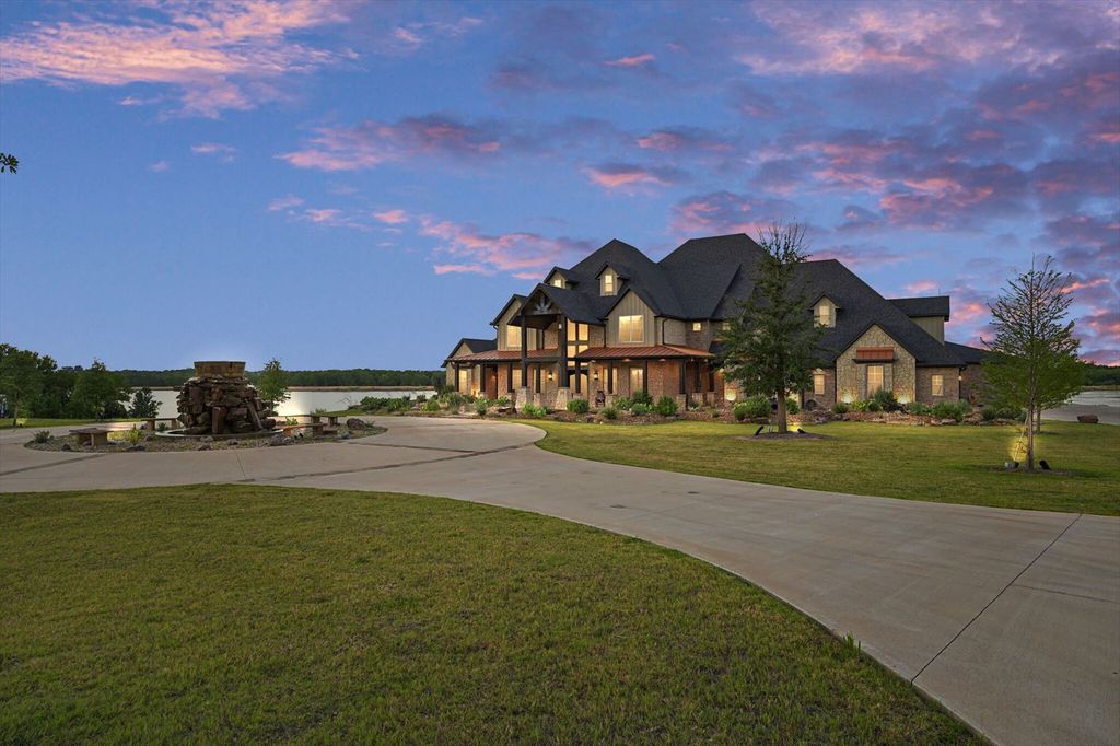 430 Chaparall Road Home in Ferris, Texas. Discover this breathtaking custom lake home nestled on 514 secluded acres, just 15 minutes south of Dallas. Meticulously constructed with stunning lake views from every room, this home features vaulted ceilings, a chef's dream kitchen, luxurious owner's suite, formal dining, study, and more. 