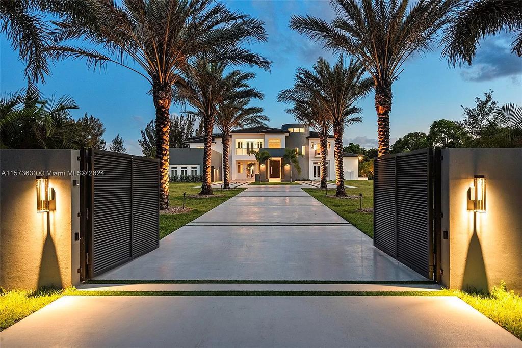 Embrace unparalleled luxury at this custom masterpiece in Southwest Ranches. Boasting over 12,000 square feet of meticulously crafted space on a sprawling 2.25-acre estate, no expense has been spared in this opulent residence.