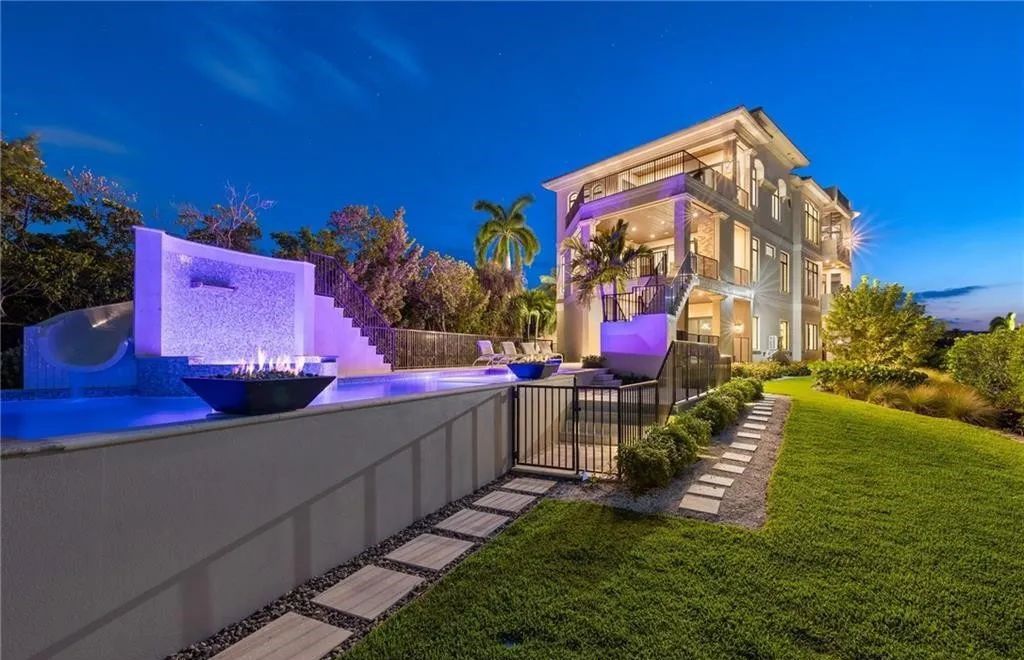 Crafted by Potter Homes in 2019, this exquisite residence boasts panoramic views of the bay and Gulf, complemented by deeded beach access to Barefoot Beach.