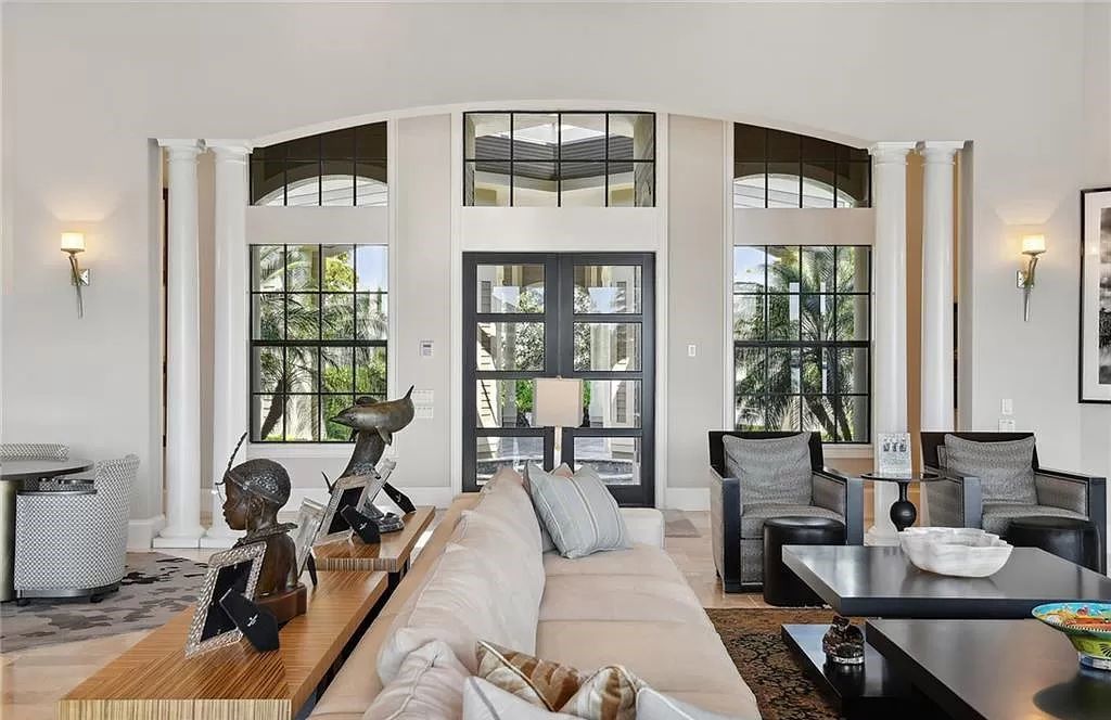 Nestled in the prestigious Estates area of Marco Island, this stunning contemporary home offers breathtaking southwestern bay views and luxurious waterfront living.