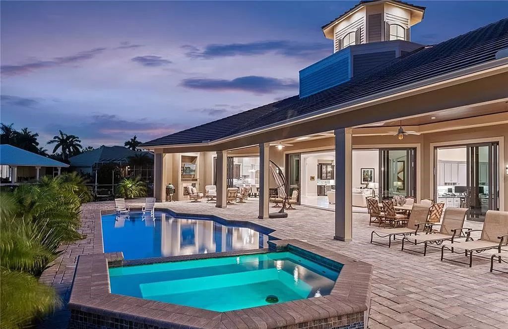 Nestled in the prestigious Estates area of Marco Island, this stunning contemporary home offers breathtaking southwestern bay views and luxurious waterfront living.